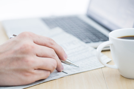 Businessman analyzing investment charts with laptop. Accountingの写真素材