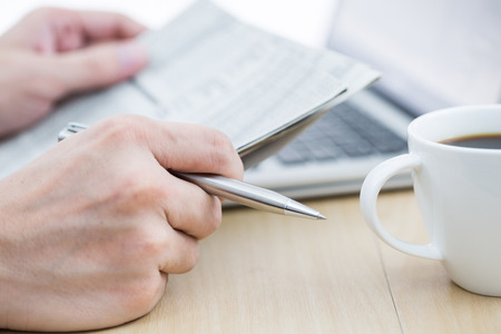 Businessman analyzing investment charts with laptop. Accountingの写真素材