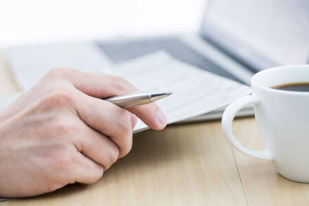 Businessman analyzing investment charts with laptop. Accountingの写真素材