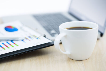 Businessman analyzing investment charts with laptop. Accountingの写真素材