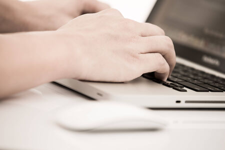 Hands of a man working with laptopの写真素材
