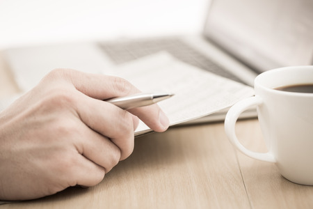 Businessman analyzing investment charts with laptop. Accountingの写真素材