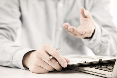 Businessman analyzing investment charts with laptop. Accountingの写真素材