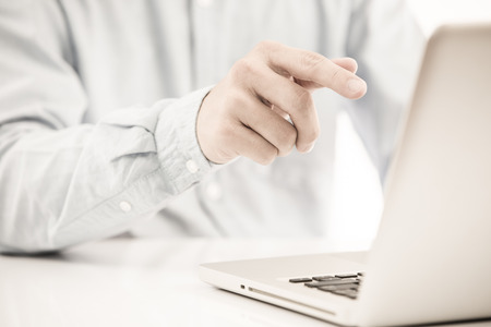 Hands of a man working with laptopの写真素材