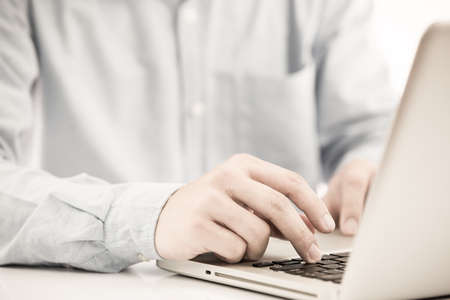 Hands of a man working with laptopの写真素材