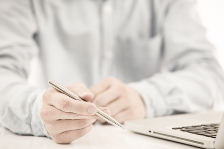 Hands of a man working with laptopの写真素材