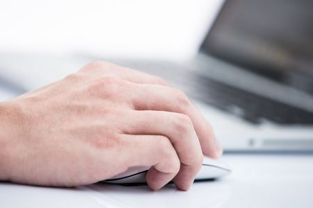 Hands of a man working with laptopの写真素材