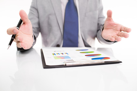 Businessman analyzing investment charts with laptop. の写真素材