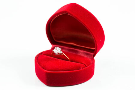 image of wedding rings in a gift box on whiteの写真素材