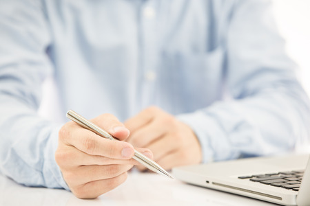 Hands of a man working with laptopの写真素材