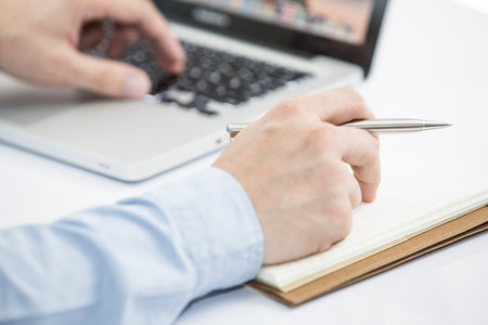 Hands of a man working with laptopの写真素材