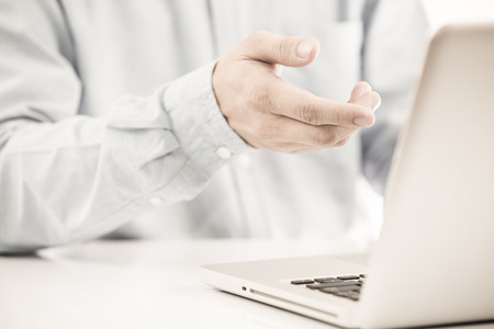 Hands of a man working with laptopの写真素材