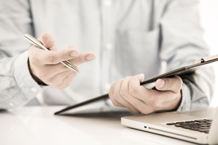 Businessman analyzing investment charts with laptop. Accountingの写真素材