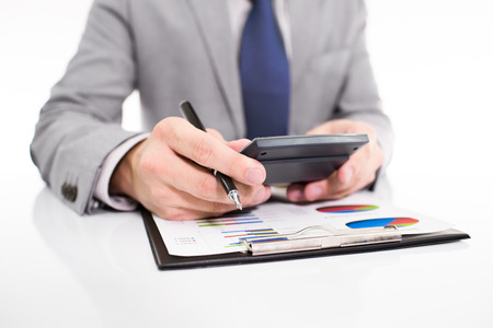 Businessman analyzing investment charts with laptop. Accountingの写真素材
