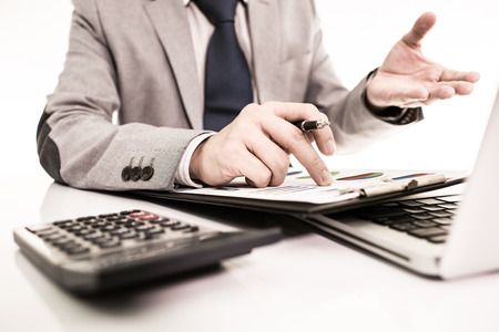 Businessman analyzing investment charts with laptop. Accountingの写真素材