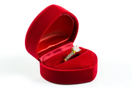 image of wedding rings in a gift box on white backgroundの写真素材