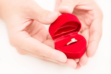 man hand and ring box on white backgroundの写真素材