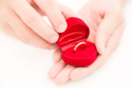 man hand and ring box on white backgroundの写真素材