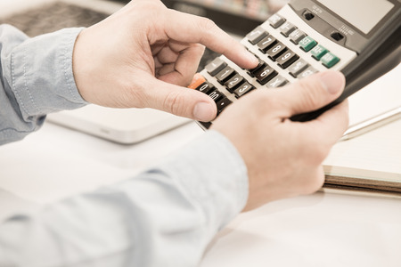 Businessman analyzing investment charts with laptop. Accountingの写真素材