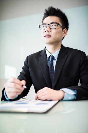 business report and man hand with pen. Accountingの写真素材