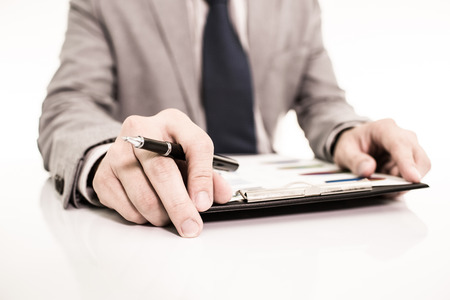 Businessman analyzing investment charts with laptop. Accountingの写真素材