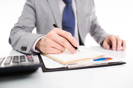 Businessman analyzing investment charts with laptop. Accountingの写真素材