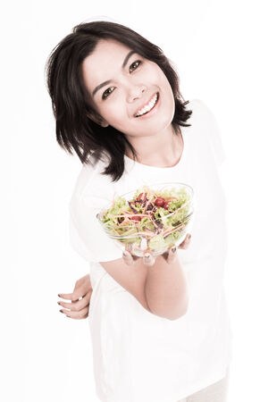 portrait of a lovely young woman eating healthyの写真素材