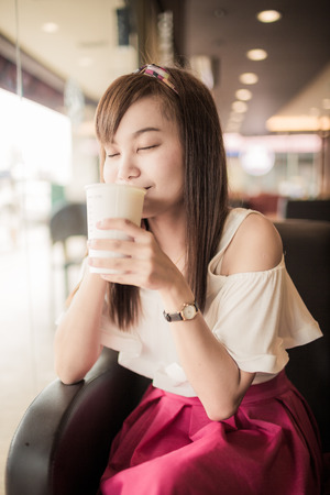 Beautiful Woman Drinking Coffeeの写真素材
