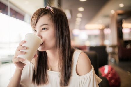 Beautiful Woman Drinking Coffeeの写真素材