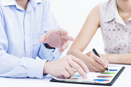 Business people discussing during a meeting on tableの写真素材