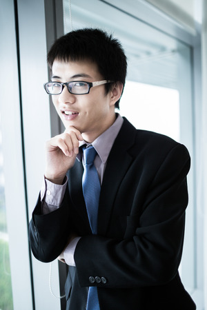 Portrait of a businessman looking at the window.Asianの写真素材