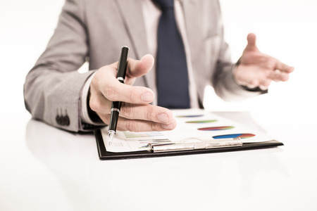 Businessman analyzing investment charts with laptop. Accountingの写真素材