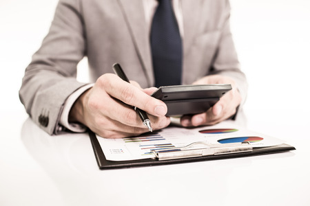 Businessman analyzing investment charts with laptop. Accountingの写真素材