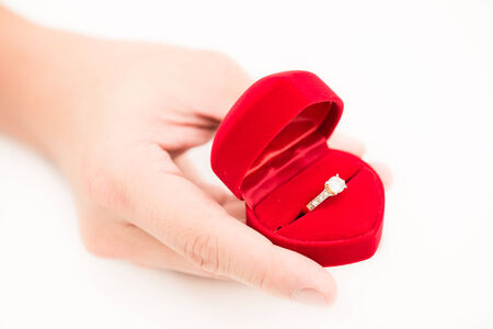 man hand and ring box on white backgroundの写真素材