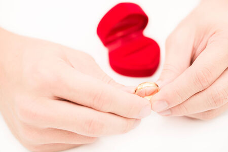 man hand and ring box on white backgroundの写真素材