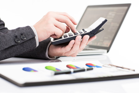 Businessman analyzing investment charts with laptop. Accountingの写真素材
