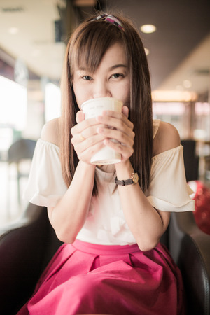 Beautiful Woman Drinking Coffeeの写真素材