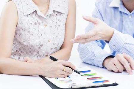 Business people discussing during a meeting on tableの写真素材