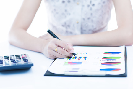 woman hand with pen and business report. Accountingの写真素材