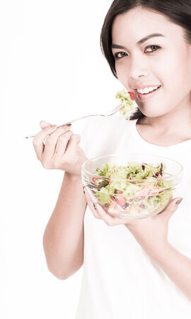 portrait of a lovely young woman eating healthyの写真素材