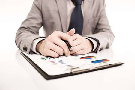 Businessman analyzing investment charts with laptop. Accountingの写真素材