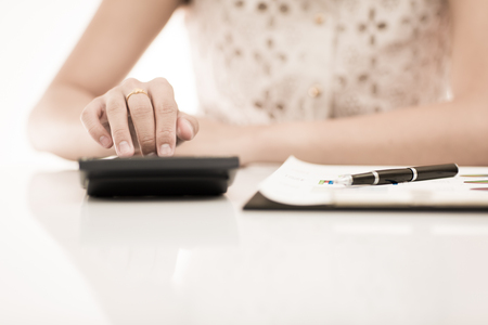 woman hand with pen and business report. Accountingの写真素材
