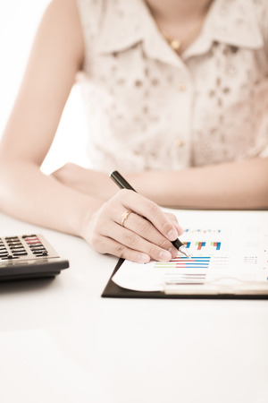 woman hand with pen and business report. Accountingの写真素材