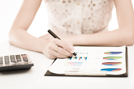 woman hand with pen and business report. Accountingの写真素材