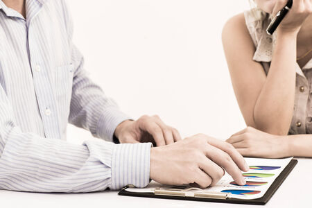 Business people discussing during a meeting on tableの写真素材