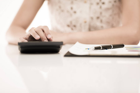 woman hand with pen and business report. Accountingの写真素材