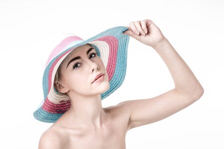Beautiful woman in a hatの写真素材