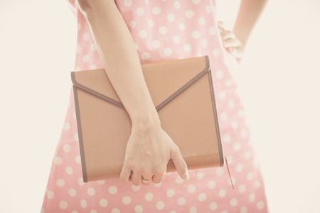 Portrait young woman holding bookの写真素材