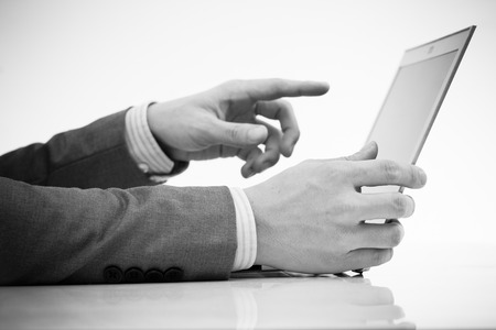 Businessman analyzing investment charts with laptop. Accountingの写真素材