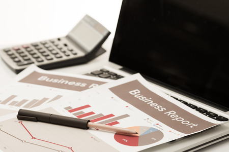 Businessman analyzing investment charts with laptop. Accountingの写真素材